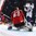 PARIS, FRANCE - MAY 9: France's Antoine Roussel #21 celebrates his teammate Stephane Da Costa #14 goal while Switzerland's Leonardo Genoni #63 looks on during preliminary round action at the 2017 IIHF Ice Hockey World Championship. (Photo by Matt Zambonin/HHOF-IIHF Images)
